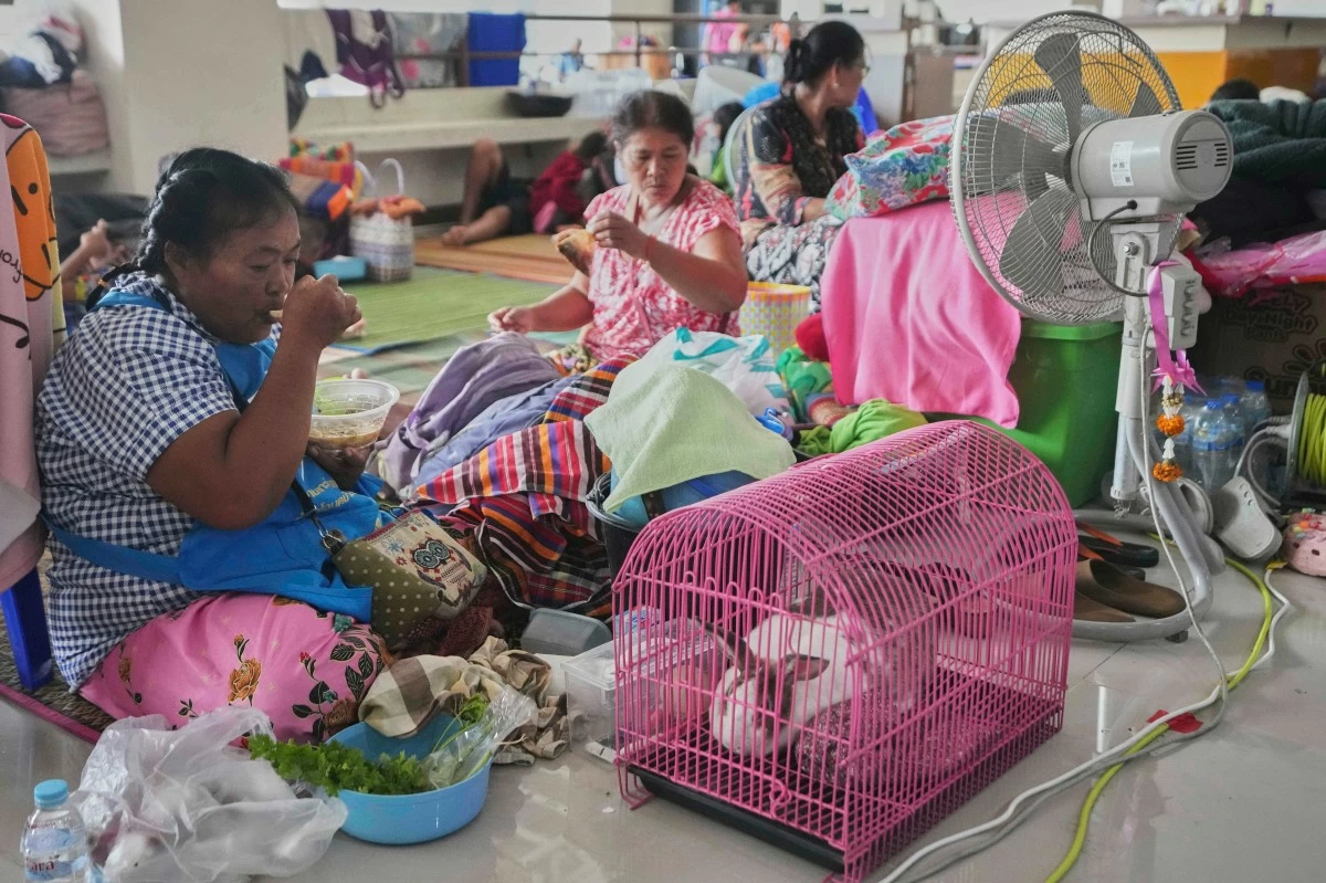 BUALEE Chanduang (left) with her rabbit who fled homes following clashes between Thai and Cambodian soldiers in an evacuation center in Surin province, Thailand, Sunday, July 27, 2025. (AP)
