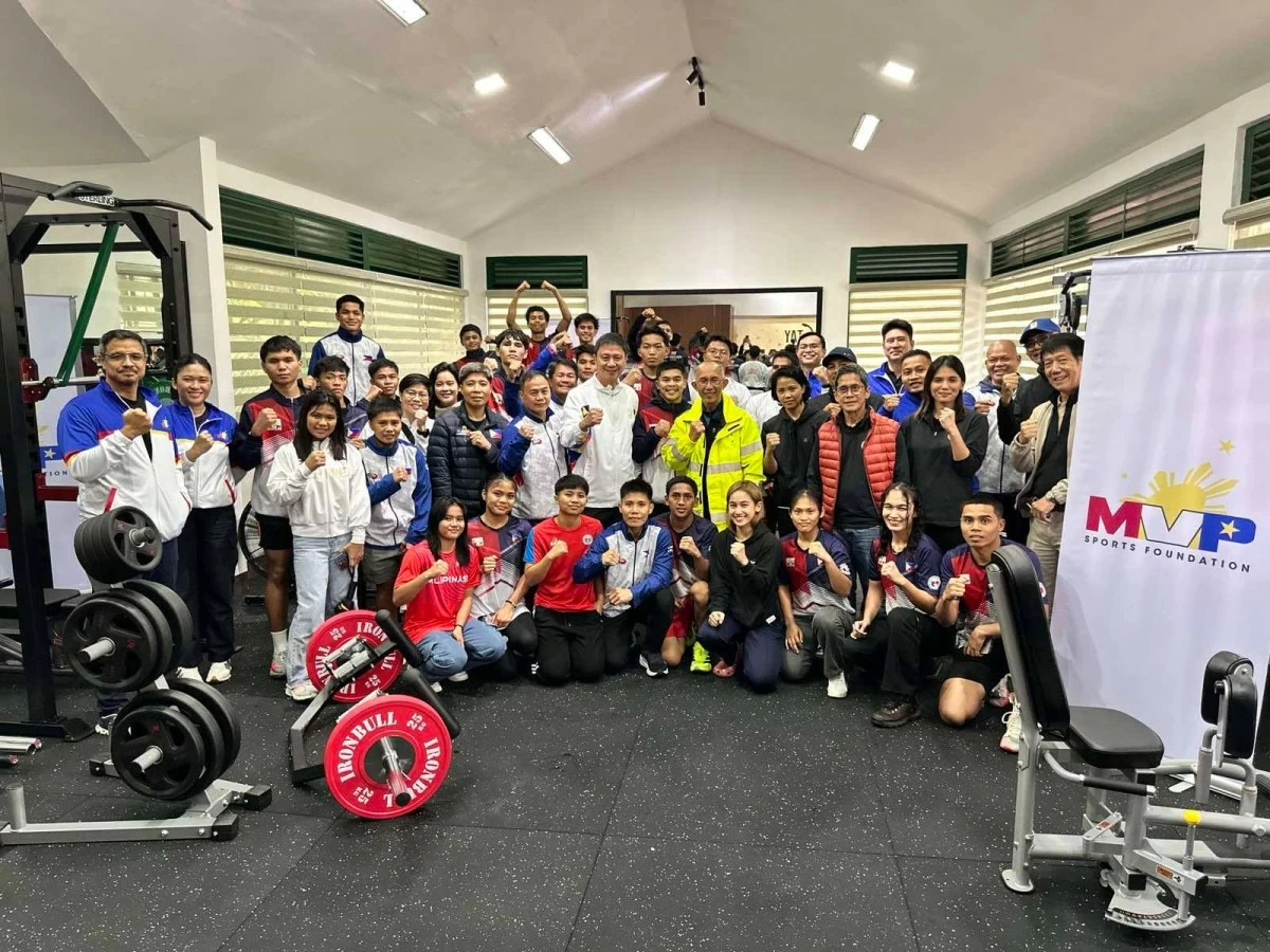PSC Chairman Pato Gregorio with national coaches and athletes at the upgraded weights training facility in Baguio City. (PSC)