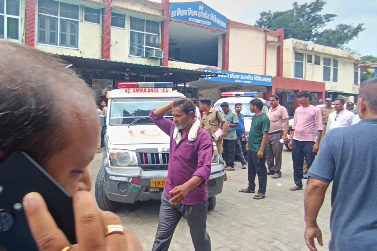 Relatives stand outside a hospital as the injured from temple stampede were brought, in Haridwar, India, Sunday, July 27, 2025. (AP Photo)