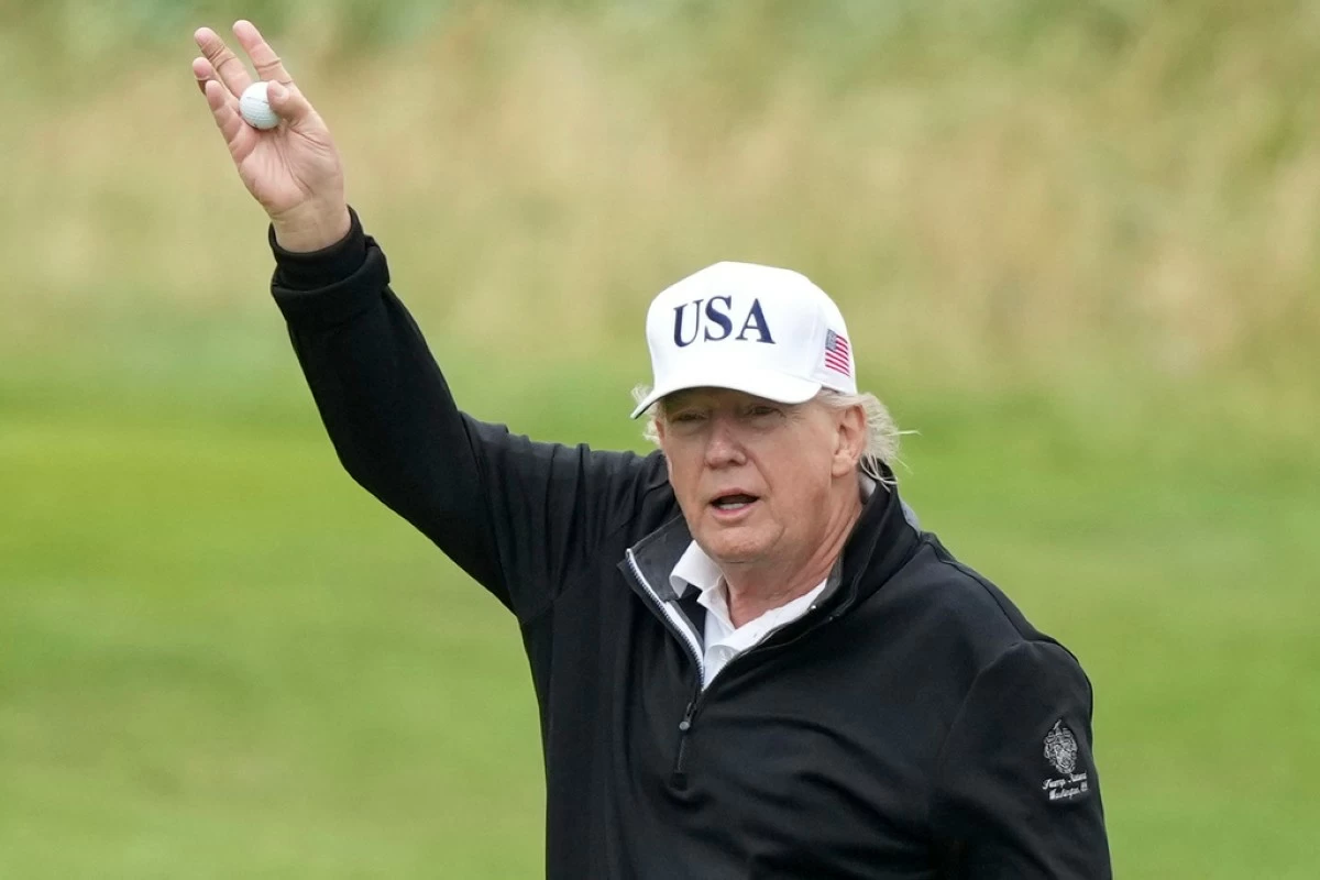 President Donald Trump waves as he plays golf at the Trump Turnberry golf course in Turnberry, Scotland, Sunday, July 27, 2025.(AP Photo/Alastair Grant)