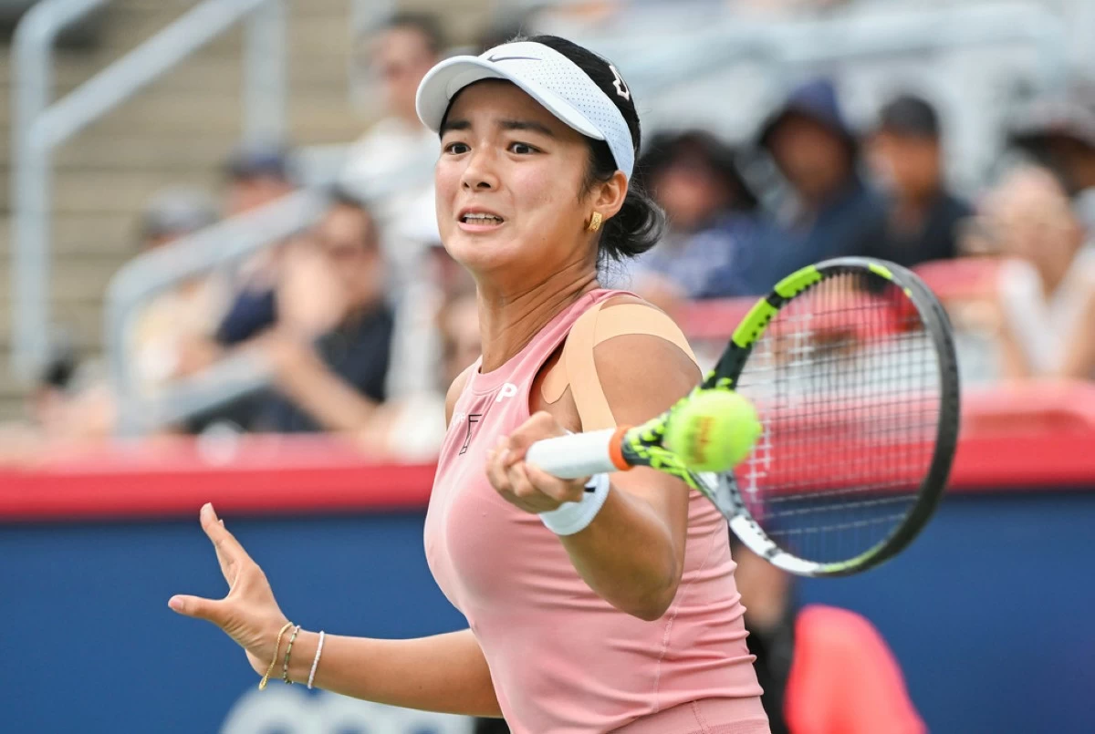 Alexandra Eala, of the Philippines, plays a shot to Marketa Vondrousova, of the Czech Republic, during their first-round match at the National Bank Open tennis tournament in Montreal, Sunday, July 27, 2025. (Graham Hughes/The Canadian Press via AP)