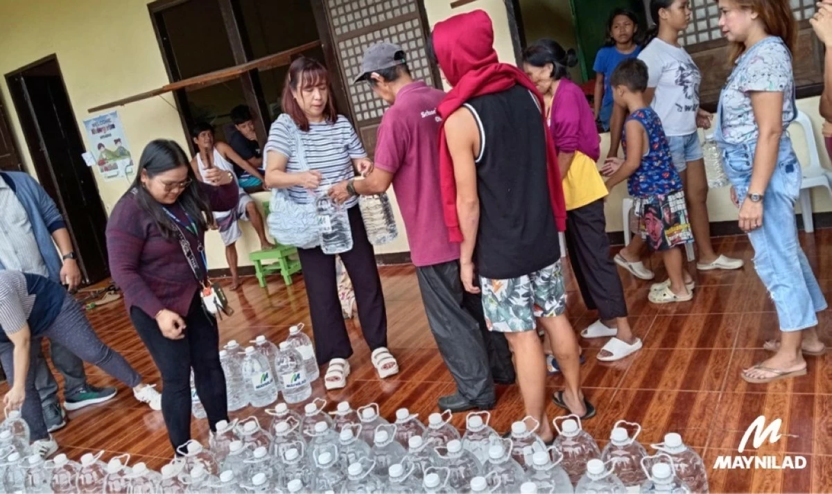 Maynilad brings safe drinking water to flood-hit families. Residents line up at an evacuation center to receive bottled water from Maynilad, which has been conducting relief operations in communities affected by Habagat-induced flooding.