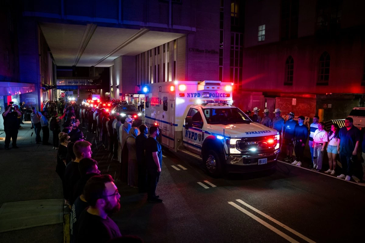The ambulance carrying the body of Didarul Islam exits NewYork-Presbyterian/Weill Cornell Medical Hospital during the dignified transfer of the slain officer, who was shot and killed by a gunman Monday evening, early Tuesday, July 29, 2025, in New York. (AP Photo/Angelina Katsanis)