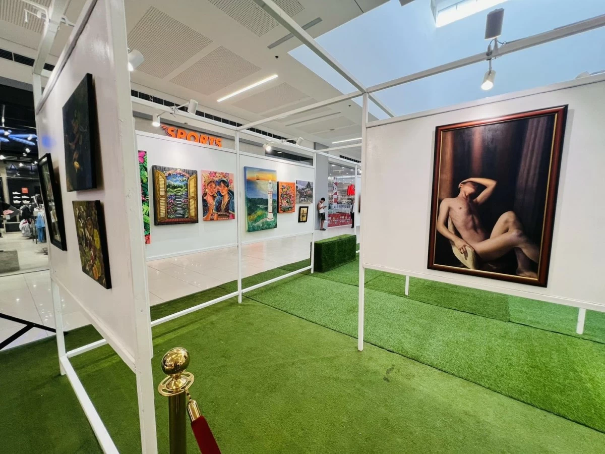 Students explore the exhibit and take photos of the art that caught their eye