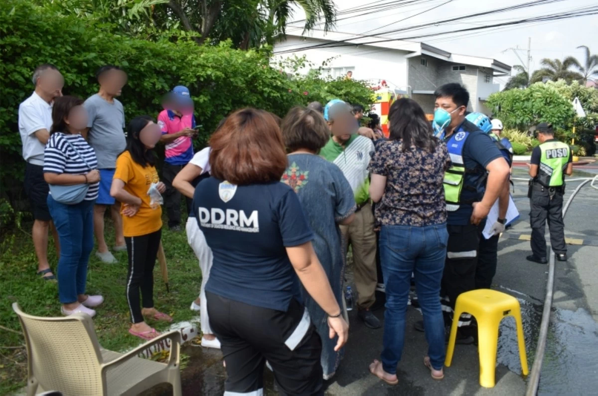 A man is being treated for burns he suffered in a fire in Alabang Hills Village in Barangay Cupang, Muntinlupa on July 29 (Photo from the Muntinlupa City Department of Disaster Resilience and Management)
