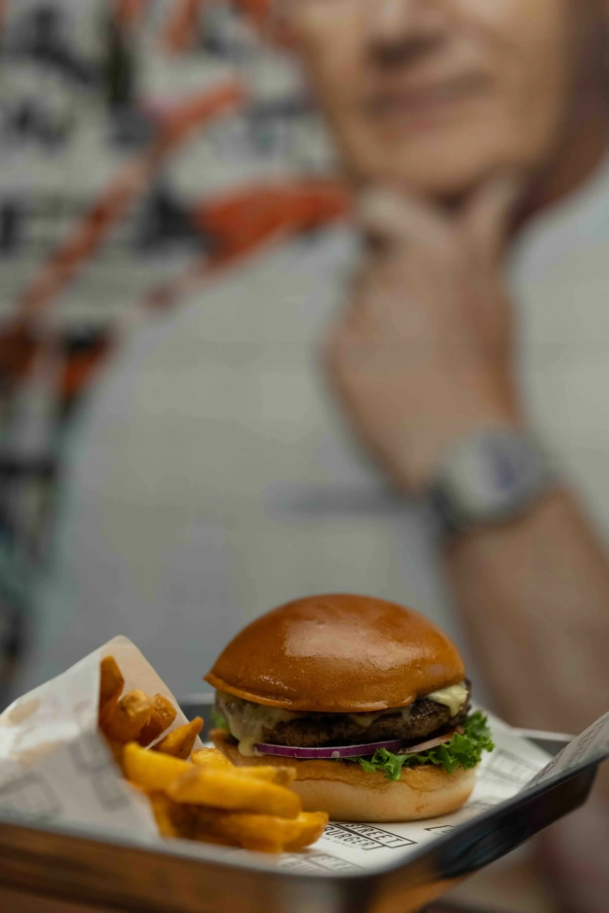 BEEF ROYALTY Short for Original Gordon Ramsay, the O.G.R. Burger is a signature stack of beef, smoked cheese, house relish, and crisp greens in a brioche bun.