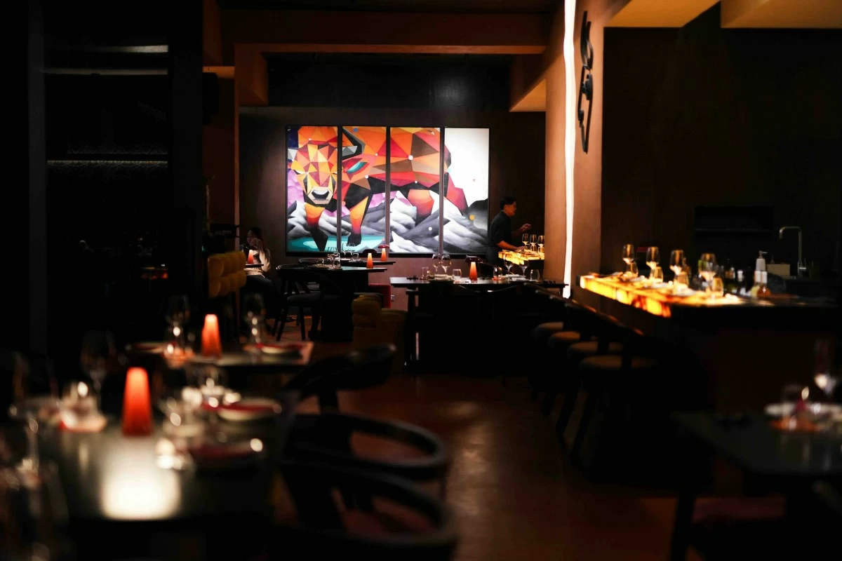 MOODY POUR A dramatic glow awaits those who step into Matador at night.