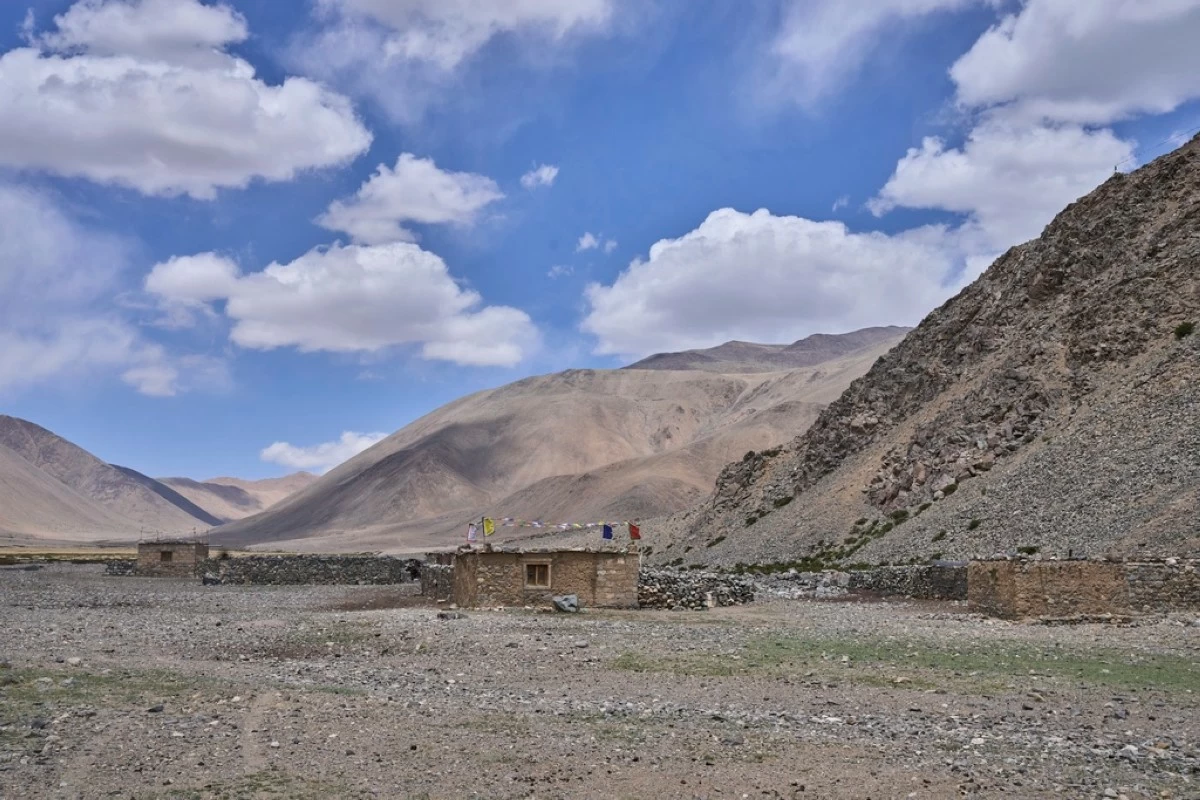 Empty stone-walled structures, or lekhas, used by Changpa nomads to shelter their animals, are visible near Yaye Tso village, Ladakh, India, Monday, July 7, 2025. (AP Photo/Dar Yasin)