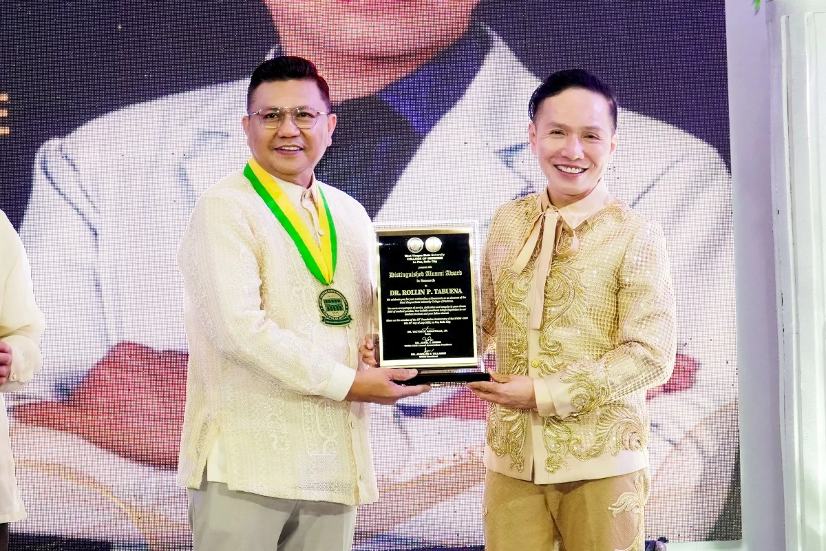 University president and co-awardee Dr. Joselito F. Villaruz presented the award to Dr. Rollin Tabuena.