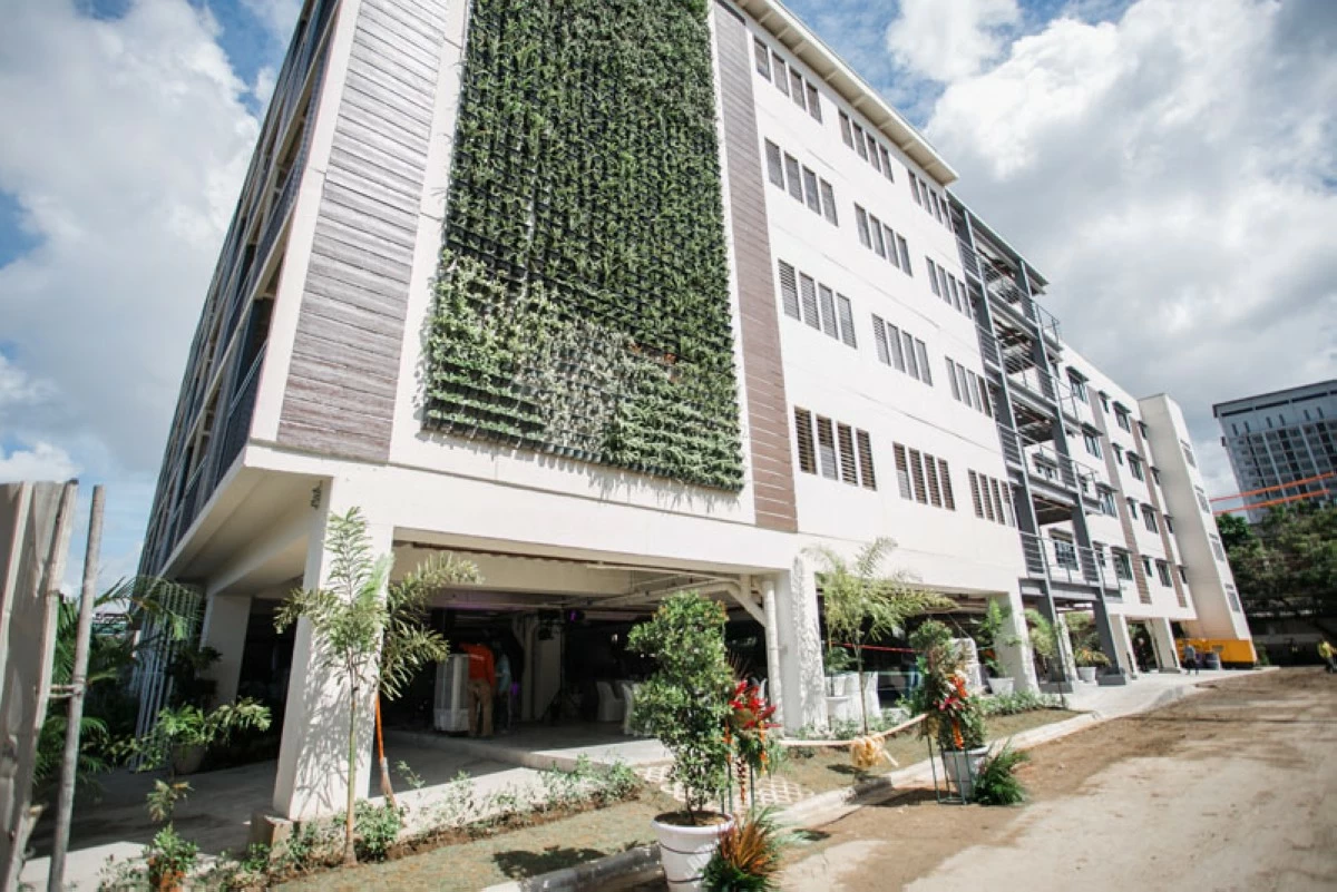 The 100-unit Walk-Up Sugbo 1 stands as the tallest socialized housing development in VisMin, a pioneering project by Cebu Landmasters, Inc., the Cebu City Government, and DHSUD. Designed for informal settlers from danger zones, the building features PWD-friendly access, solar-powered common areas, a chapel, retail spaces, and a Livelihood Training Hall—raising the bar for inclusive and sustainable community living in the Philippines.