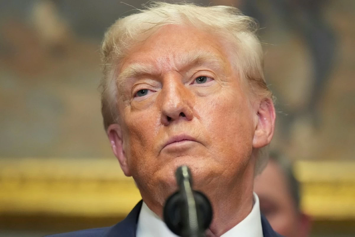 President Donald Trump listens during an event to sign an executive order restarting the Presidential Fitness Test in public schools, Thursday, July 31, 2025, in the Roosevelt Room of the White House in Washington. (AP Photo/Jacquelyn Martin)
