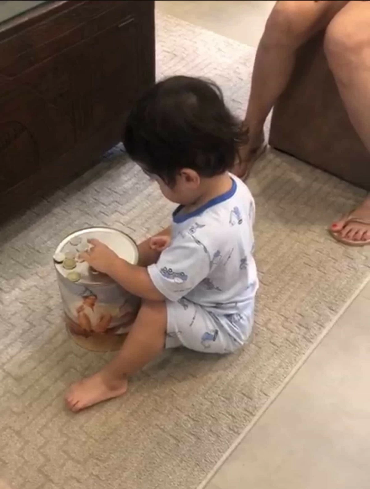 Counting their coins as they keep them in their coin banks.
