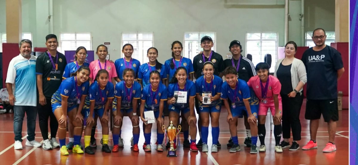 Members of the Capital1 Solar Strikers pose with supporters and league officials after winning the PAGSS Women’s Futsal Cup.