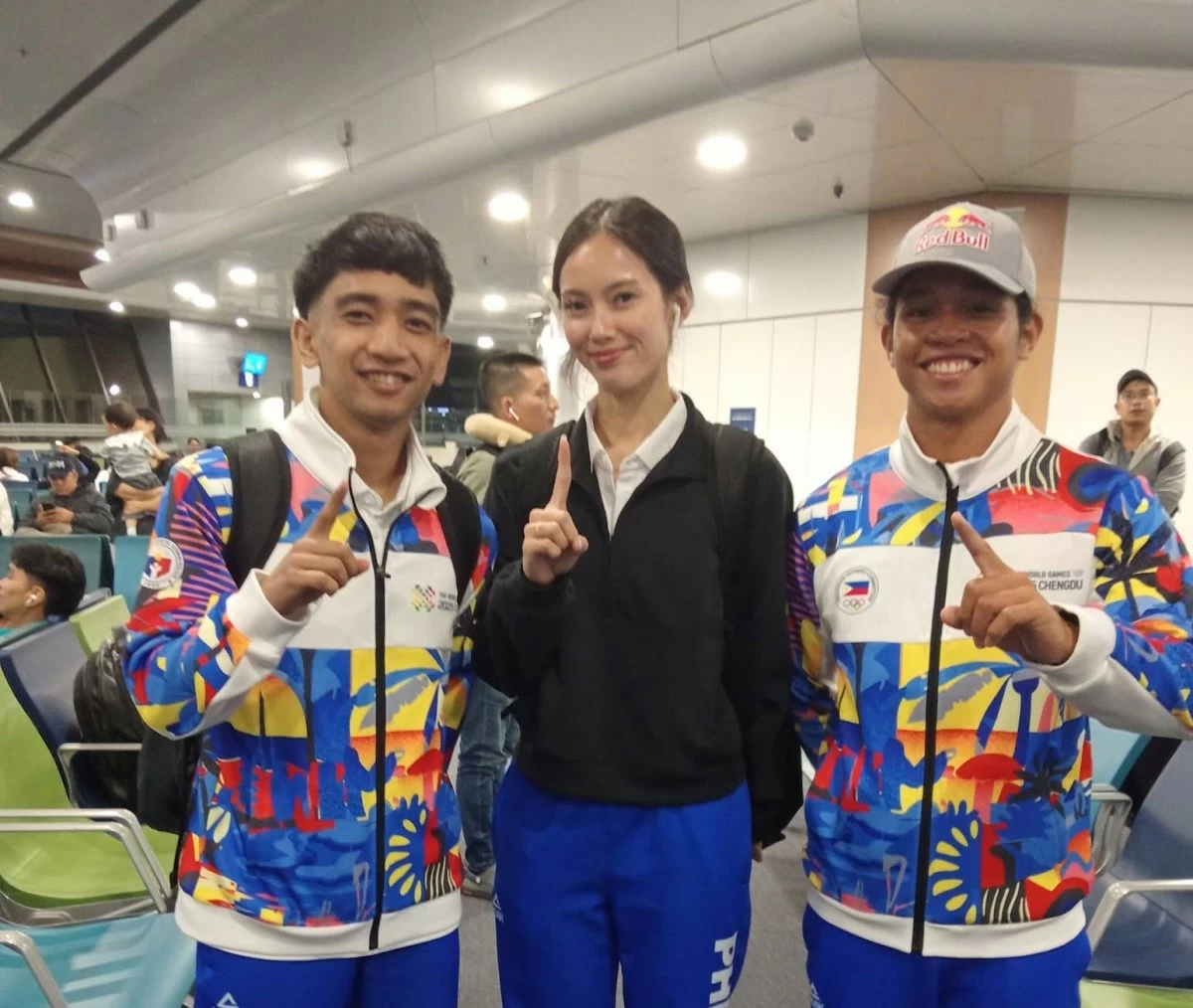 WUSHU ARTIST Jones Inso, left, with Philippine team flag bearers Agatha Wong, center, and Raph Trinidad are ready to compete in the World Games in Chengdu, China.