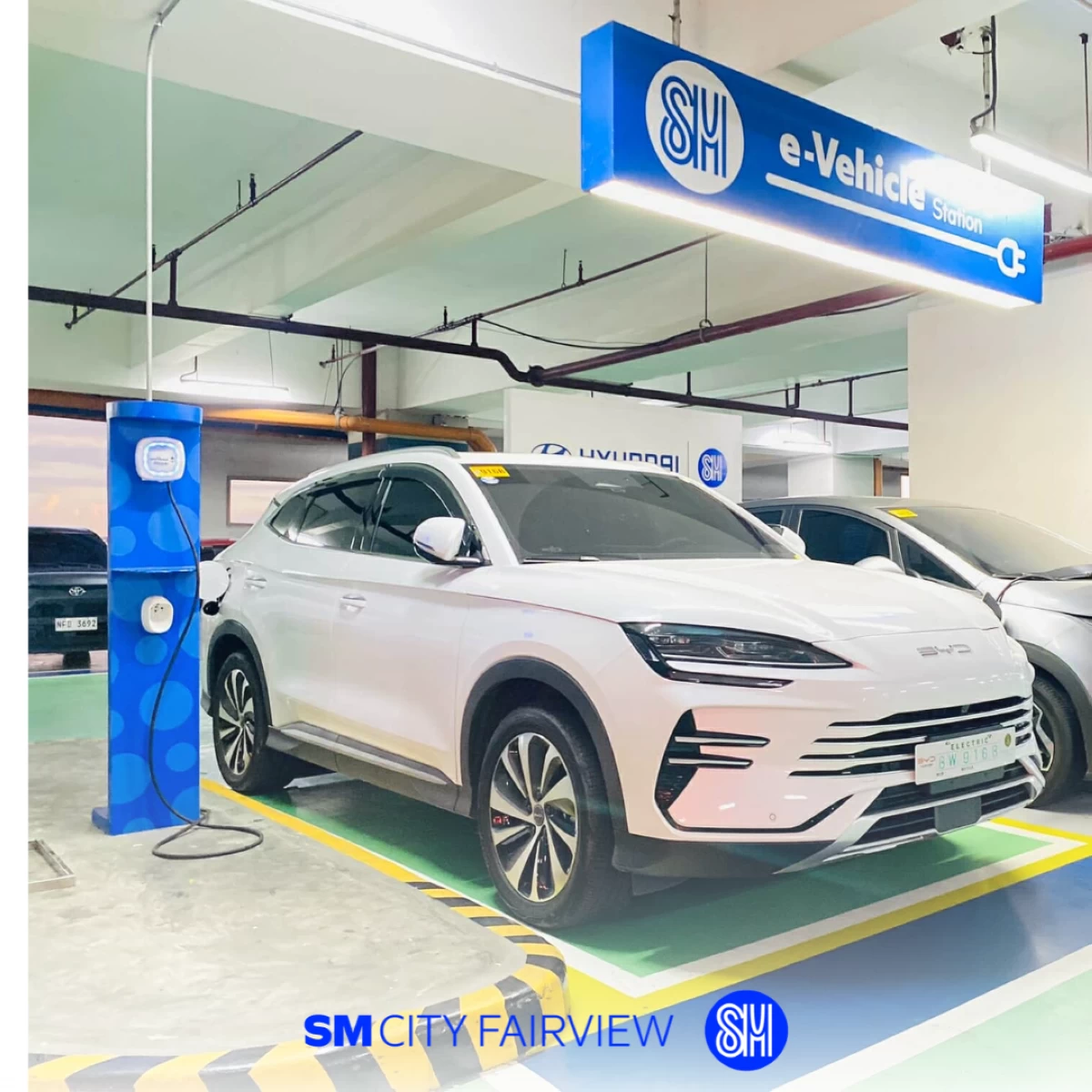 An electric vehicle charges at SM City Fairview’s Electric Vehicle Charging Station—one of 123 across 69 SM Supermalls nationwide.