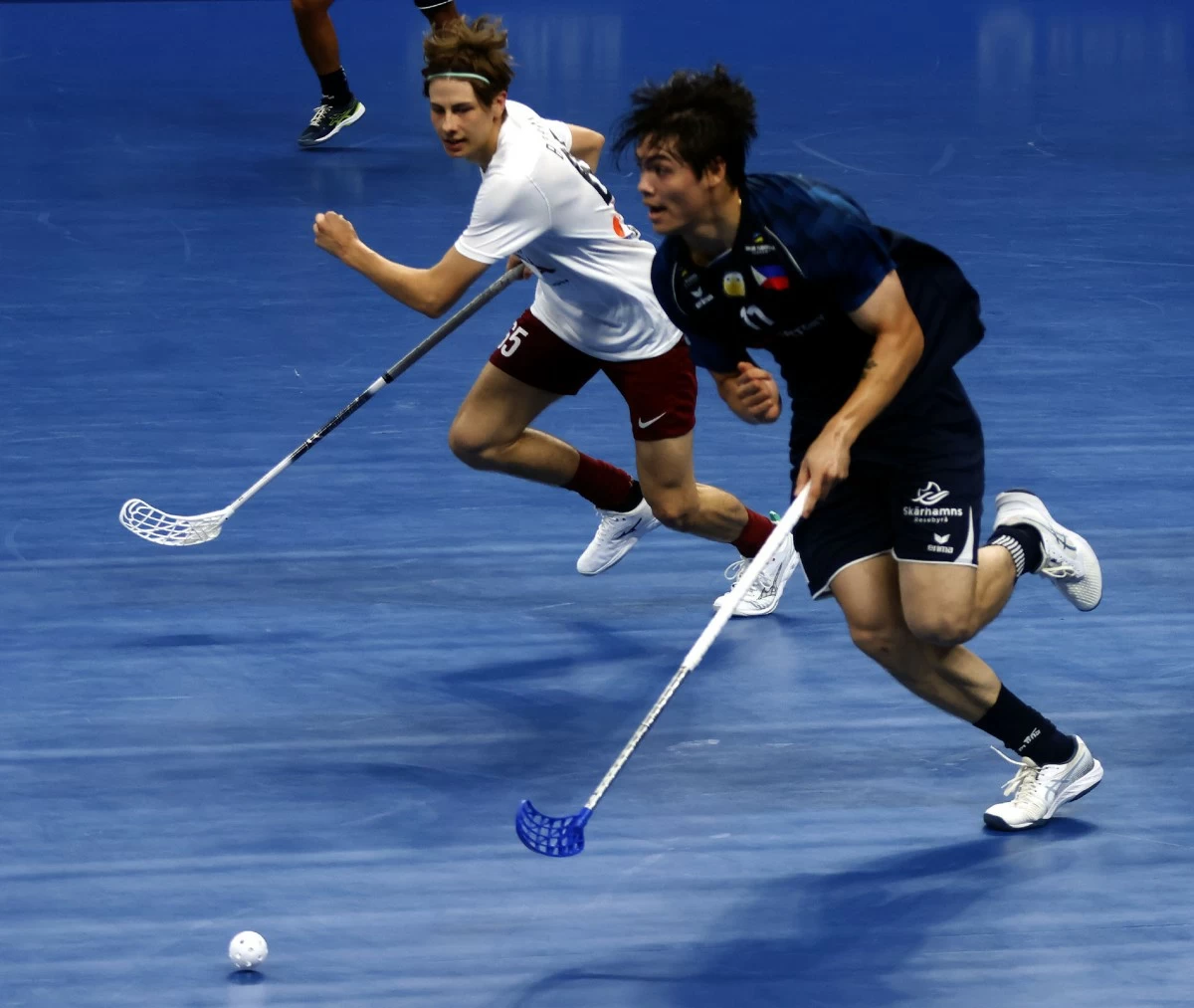
SIMON LARANO (right) protects the ball against Latvia's Karlis Bitmanis during their Chengdu World Games match Thursday at the Xindu Xiangcheng Sports Centre.