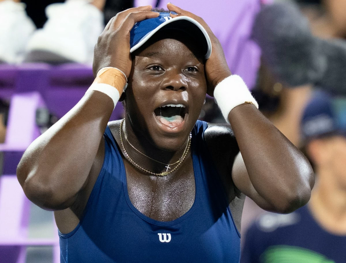 Victoria Mboko of Canada reacts following her win over Elena Rybakina of Kazakhstan during semifinal tennis action at the National Bank Open in Montreal, Wednesday, Aug. 6, 2025. (Christinne Muschi/The Canadian Press via AP)