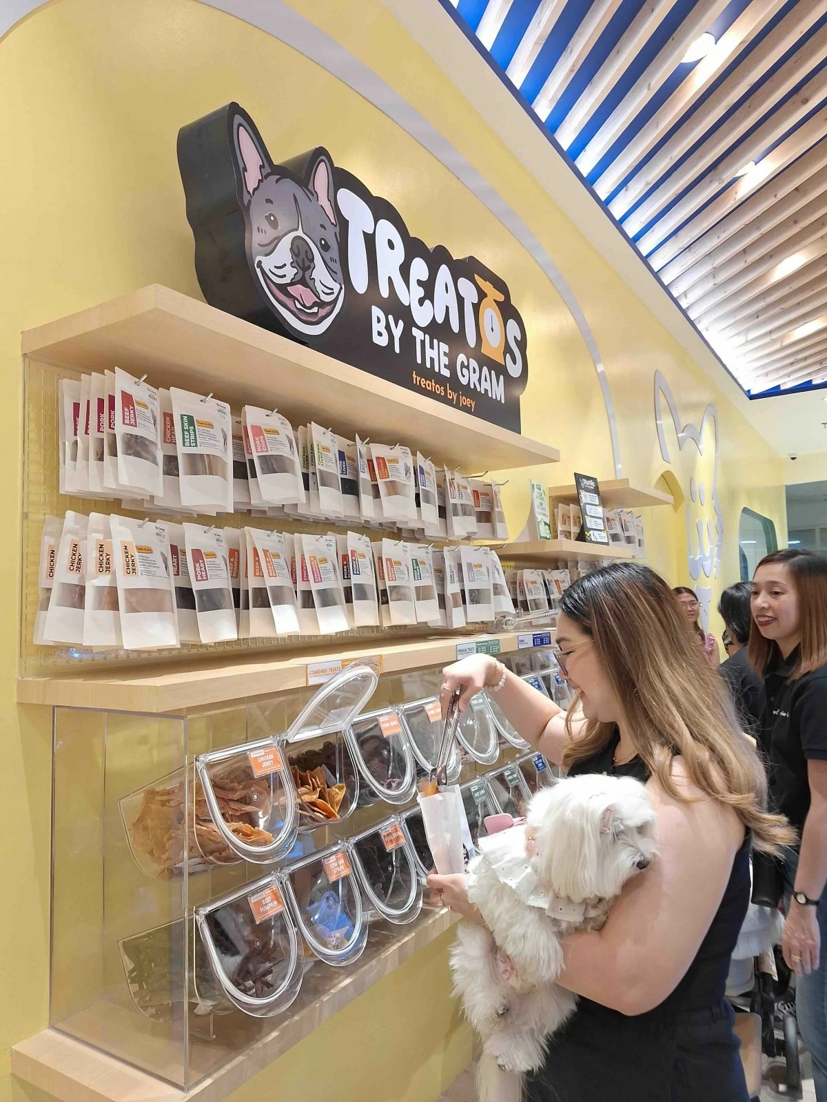 Fur parent scoops up goodies for her baby