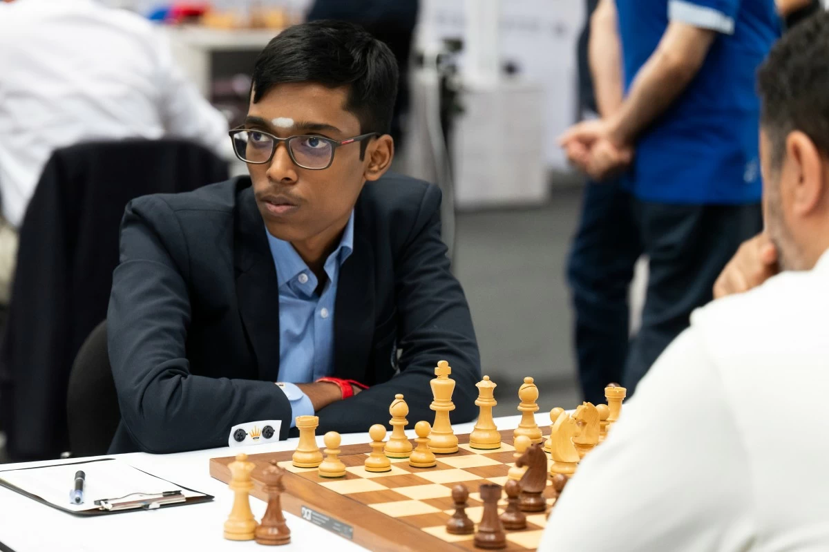 FILE - Rameshbabu Praggnanandhaa, of India, left, focuses during his game with Tissir Mohamed, of Morocco, at the 45th Chess Olympiad in Budapest, Hungary, on Sept. 11, 2024. (AP Photo/Denes Erdos)