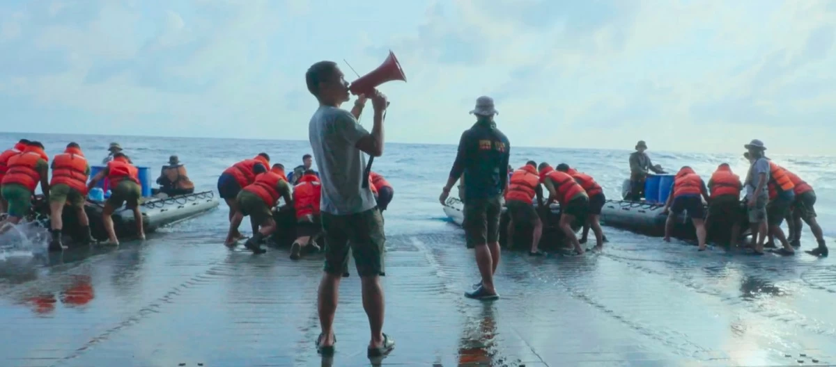 TIED FORCES The Philippine Coast Guard and Philippine Navy unite to deliver supplies