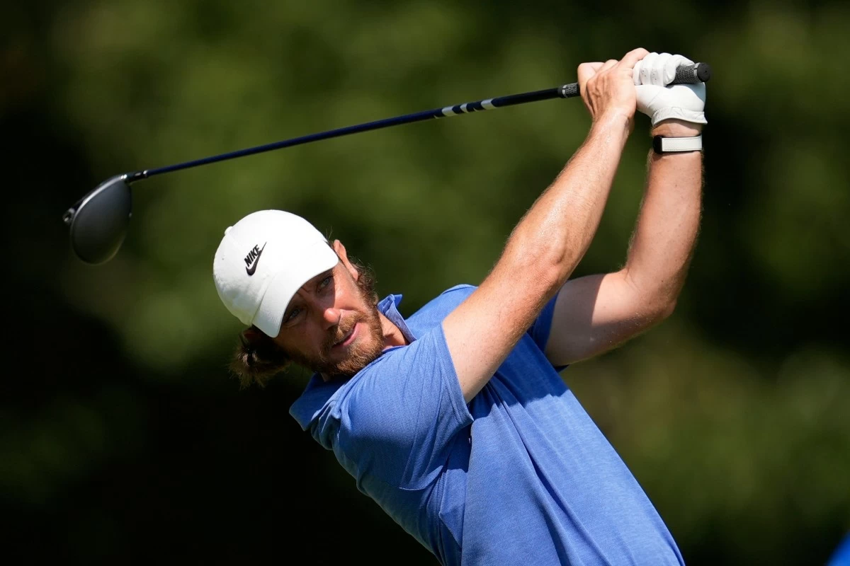 Tommy Fleetwood, of England, watches his tee shot on the seventh hole during the second round of the St. Jude Championship golf tournament Friday, Aug. 8, 2025, in Memphis, Tenn. (AP Photo/George Walker IV)