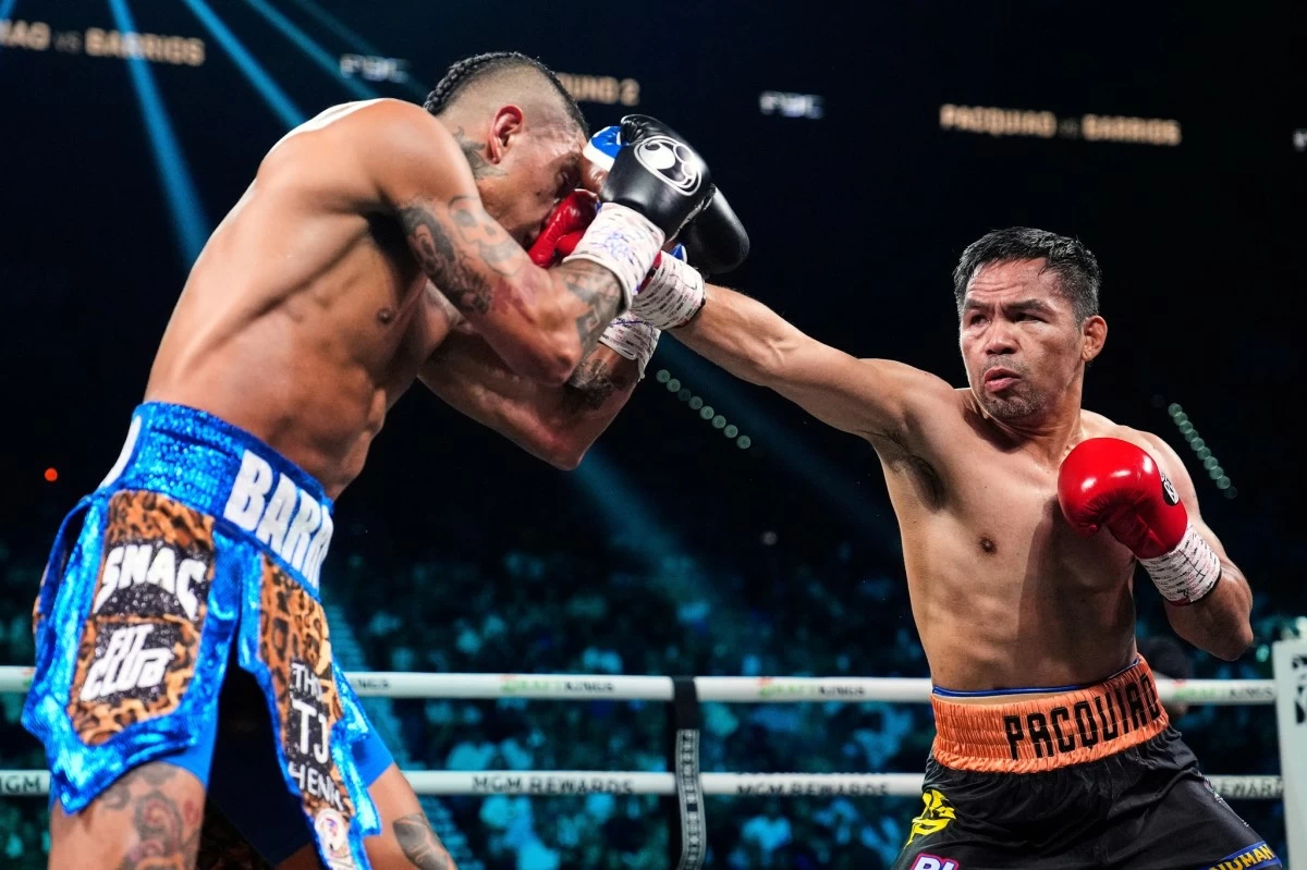 Mario Barrios, left, fights Manny Pacquiao in a welterweight title boxing match Saturday, July 19, 2025, in Las Vegas. (AP Photo/John Locher)