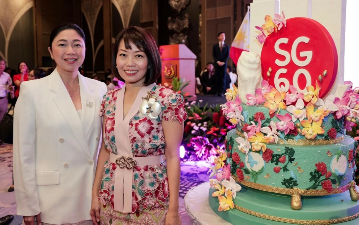 Taguig City Mayor Lani Cayetano with Ambassador Constance See poses before the  lovely cake
