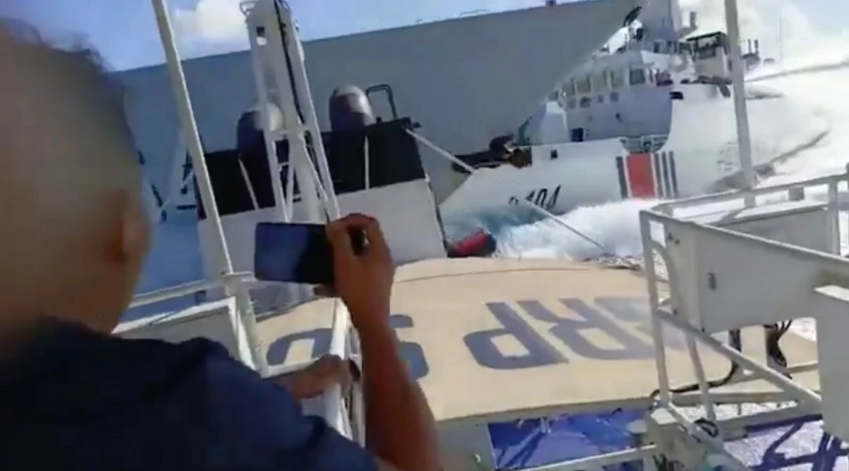 The image shows the exact moment when China Coast Guard (CCG) ship 