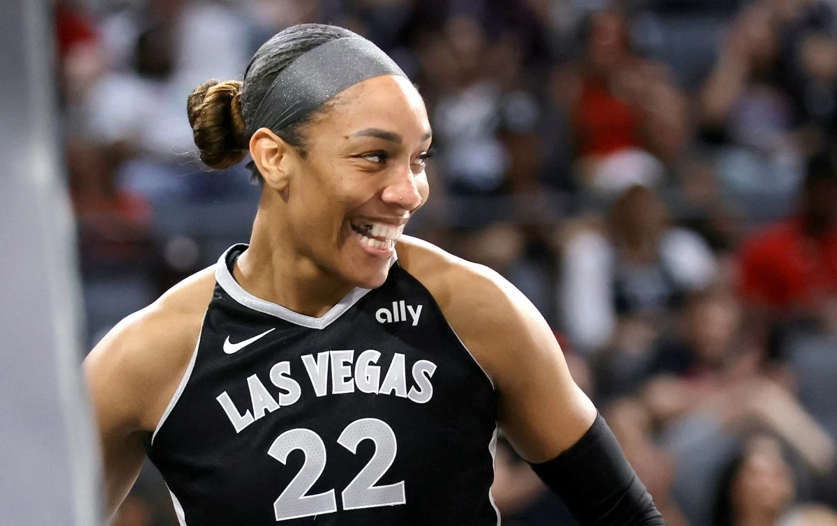 Las Vegas Aces center A'ja Wilson reacts after making a basket and drawing a foul during the second half of a WNBA basketball game against the Connecticut Sun, Sunday, Aug. 10, 2025, in Las Vegas. (Steve Marcus/Las Vegas Sun via AP)