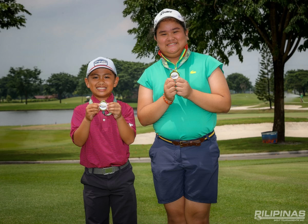 Zoji Edoc, left, and Ronee Dungca proudly shows their medal.