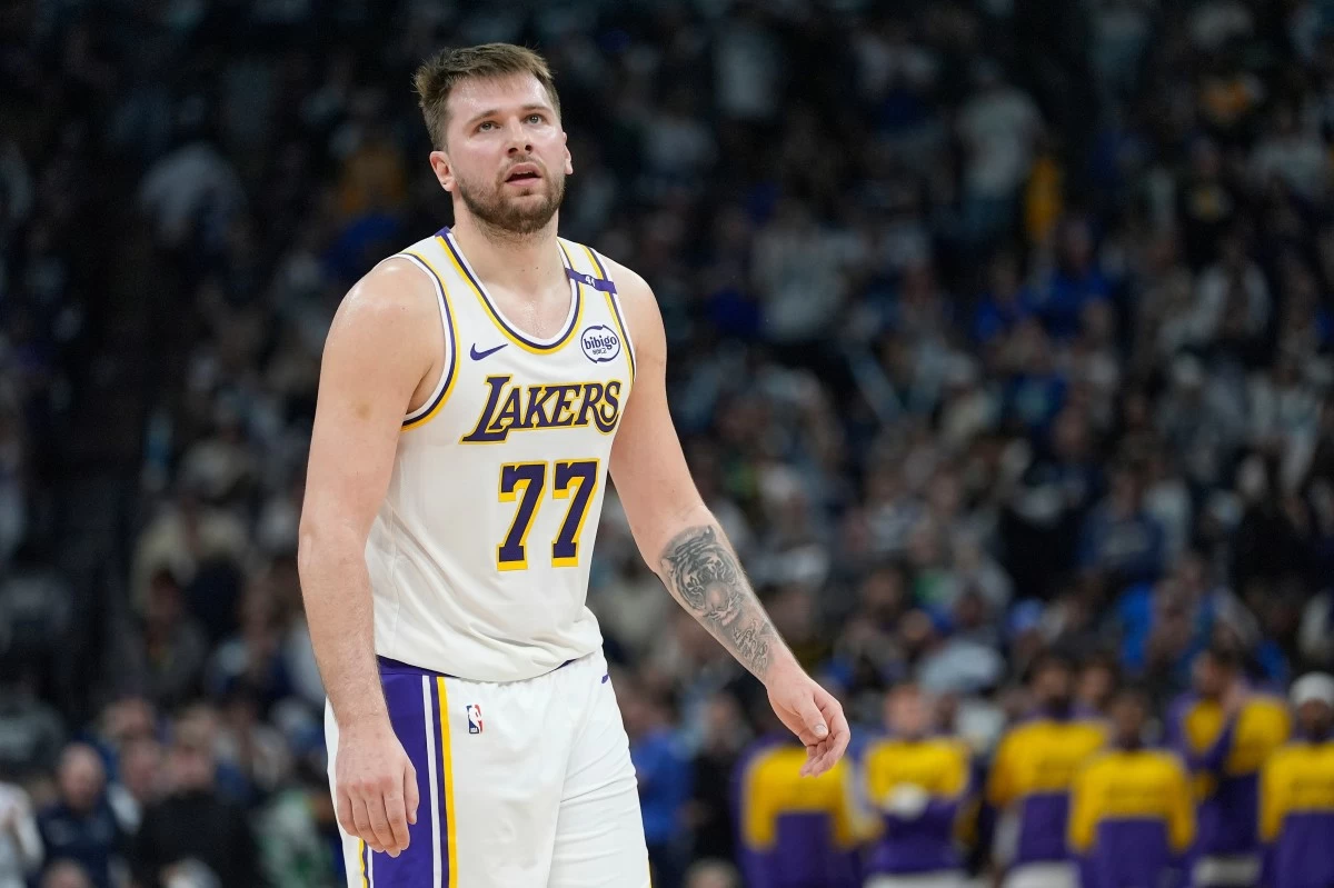 FILE - Los Angeles Lakers guard Luka Doncic (77) reacts after a foul called on the Lakers during the first half of Game 4 of an NBA basketball first-round playoff series against the Minnesota Timberwolves, Sunday, April 27, 2025, in Minneapolis. (AP Photo/Abbie Parr, File)