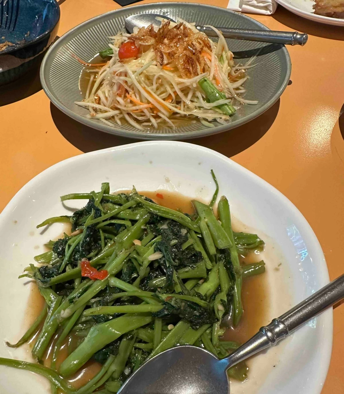 Pad Pak Boong Fai Daeng (bottom) and Som Tum Thai