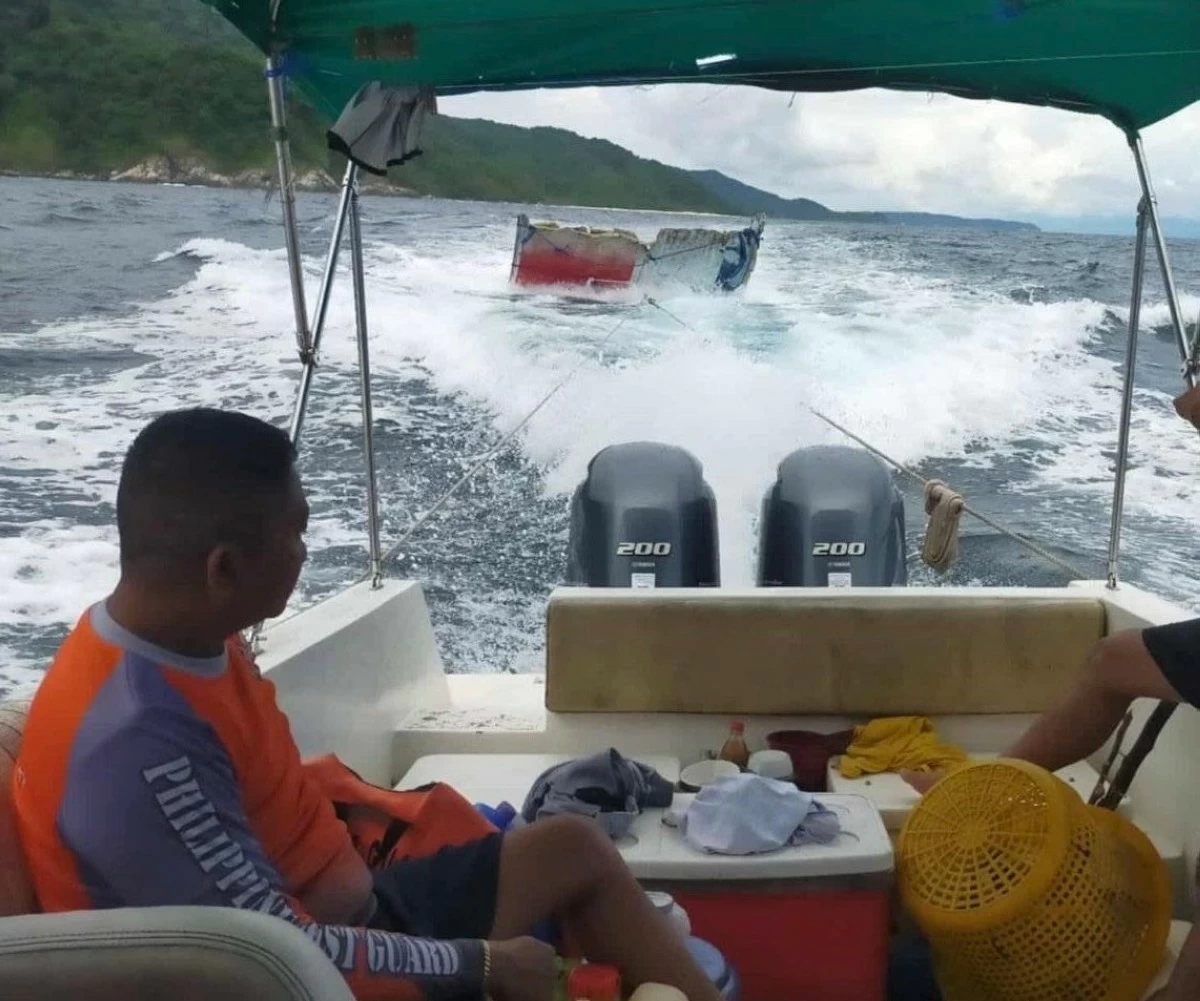 Philippine Coast Guard (PCG) personnel retrieve a floating rocket debris bearing markings of Chinese flag off Looc, Occidental Mindoro on Aug. 14, 2025. (Photo: PCG)