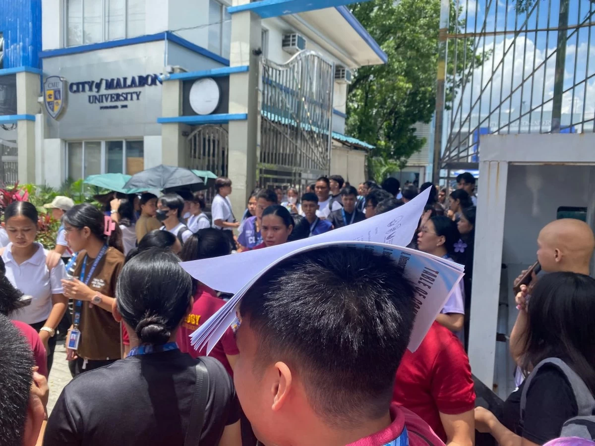Students leave the City of Malabon University campus on Friday, August 15, after a bomb scare prompted an evacuation and suspension of face-to-face classes (Photo from school publication)