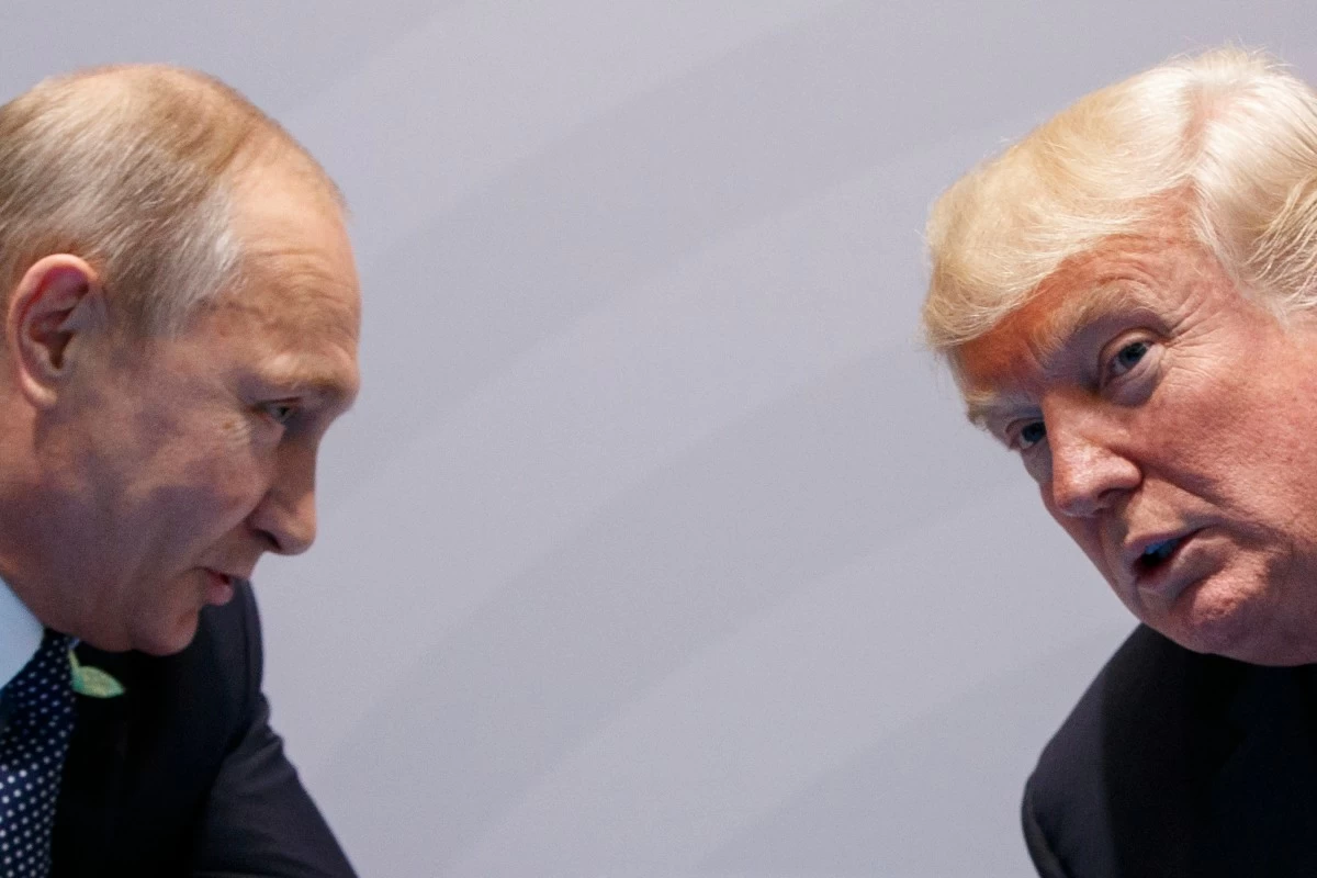 FILE - U.S. President Donald Trump meets with Russian President Vladimir Putin at the G-20 Summit on July 7, 2017, in Hamburg, Germany. (AP Photo/Evan Vucci, File)