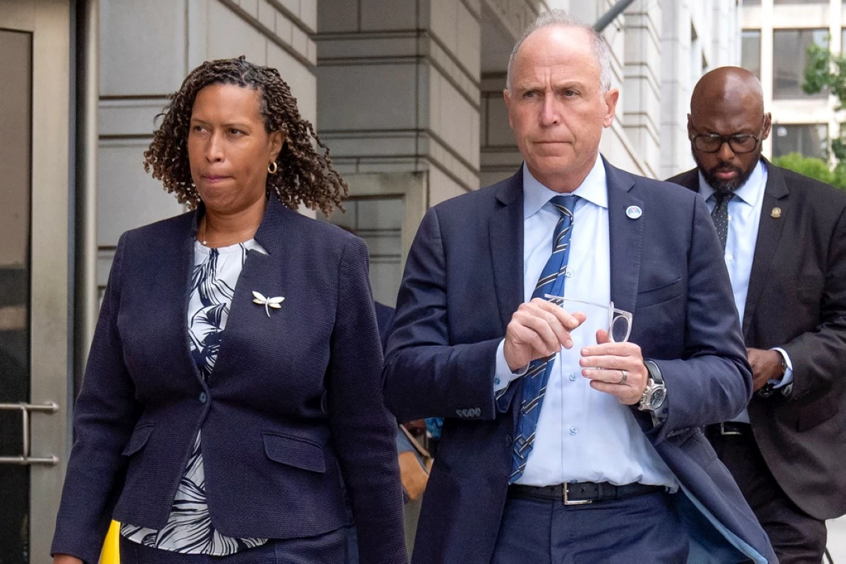 District of Columbia Mayor Muriel Bowser, left, and District of Columbia Attorney General Brian Schwalb walk out of federal court in Washington, Friday, Aug. 15, 2025. (AP Photo/Mark Schiefelbein)