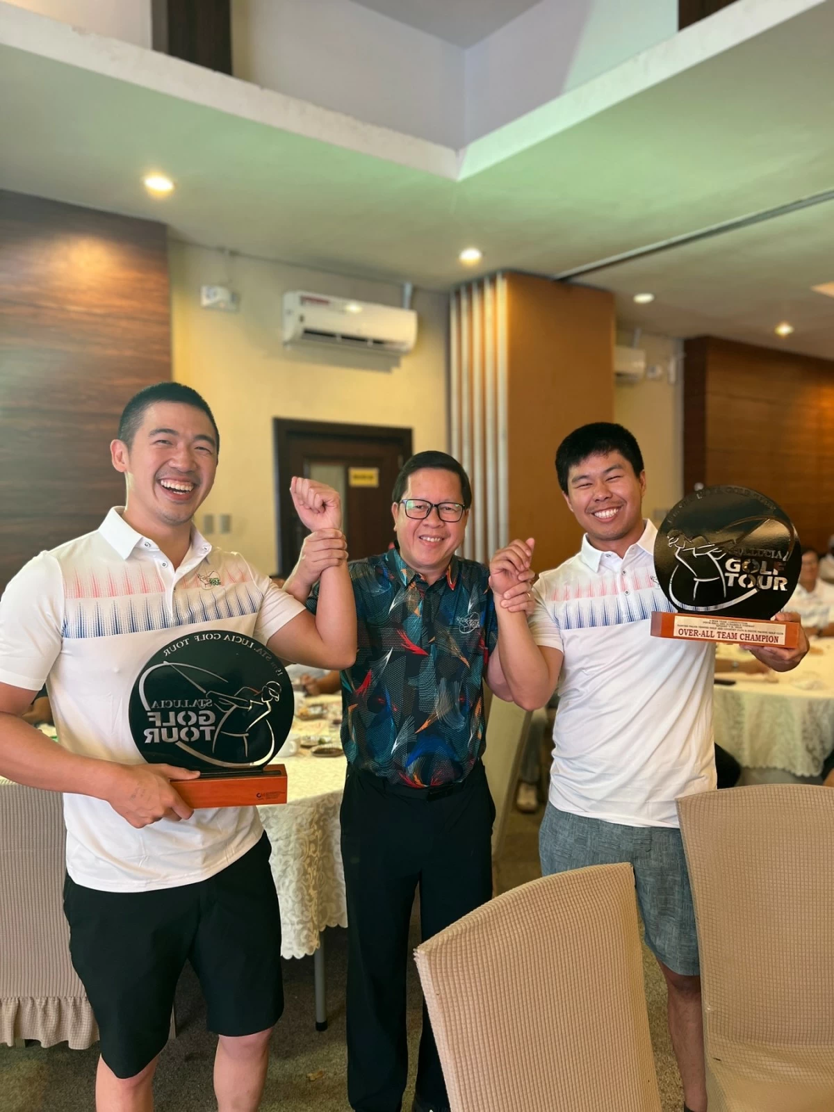 Ralph Chong, from left, Orchard golf director Francis Montallana and Aldric Yao
