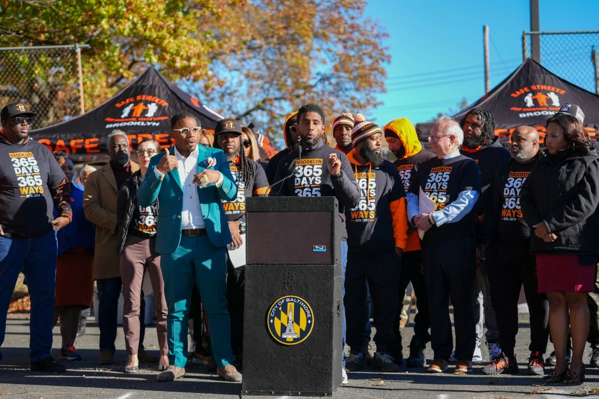 FILE - Baltimore Mayor Brandon Scott, center, speaks during a news conference to celebrate achieving over 365 days without a homicide within the Brooklyn neighborhood Safe Streets catchment zone, Tuesday, Nov. 12, 2024, in Baltimore. (AP Photo/Stephanie Scarbrough, File)