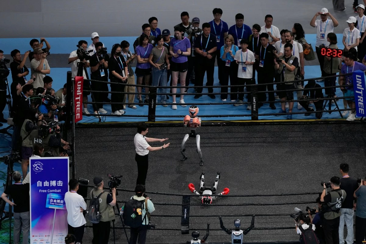 Robots participate in the Free Combat event at the World Humanoid Robot Games held in Beijing, China, Friday, Aug. 15, 2025. (AP Photo/Mahesh Kumar A.)