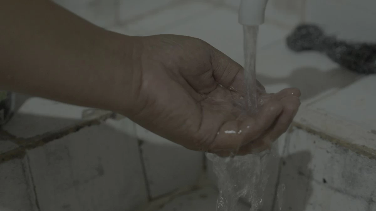 Clean water flows steadily from a tap in Panacan Relocation