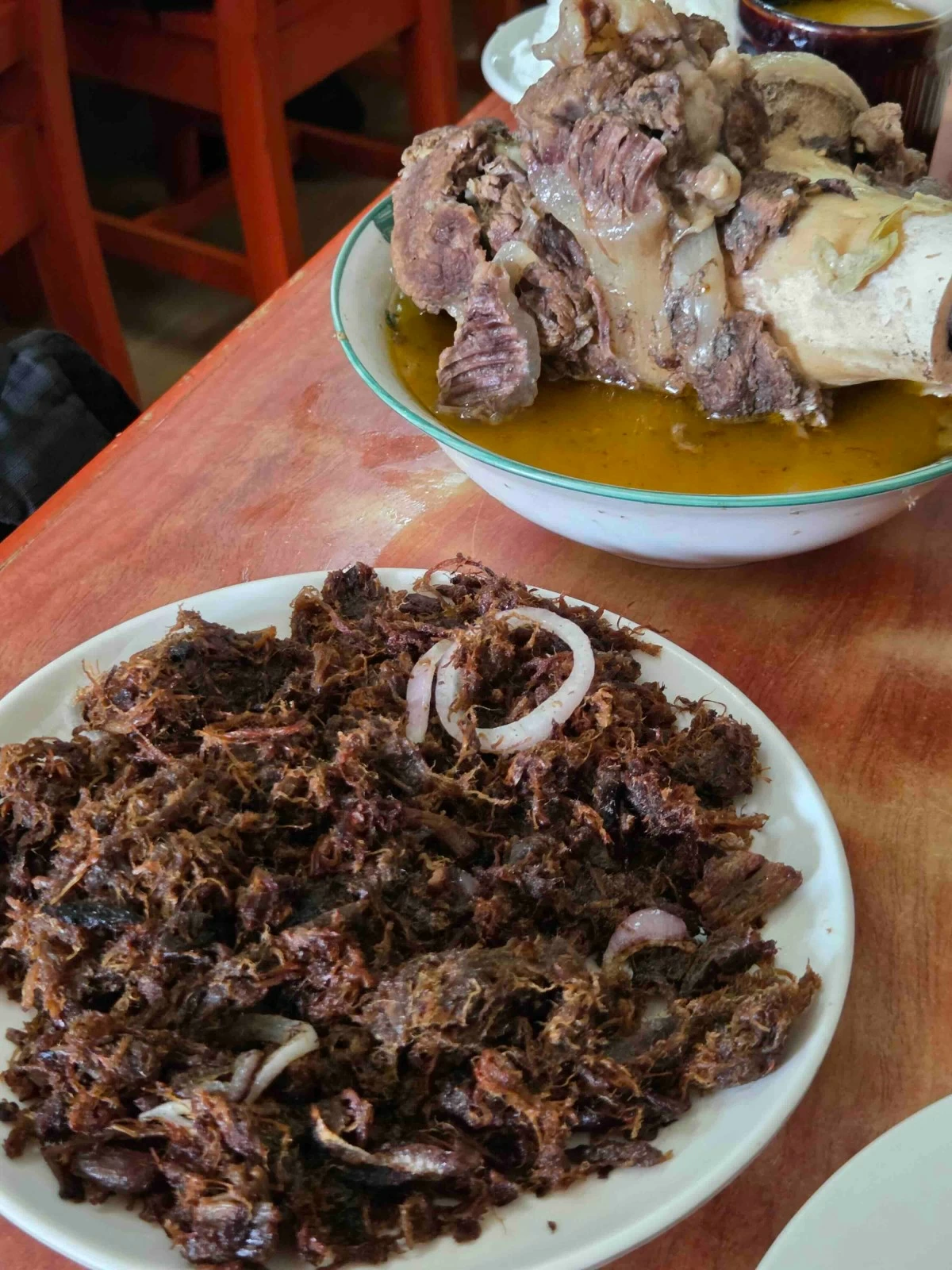 SOUR COMFORT Bacolod’s signature cansi soup, slow-simmered with beef shank and batuan, alongside the crispy fried version at Sharyn’s.