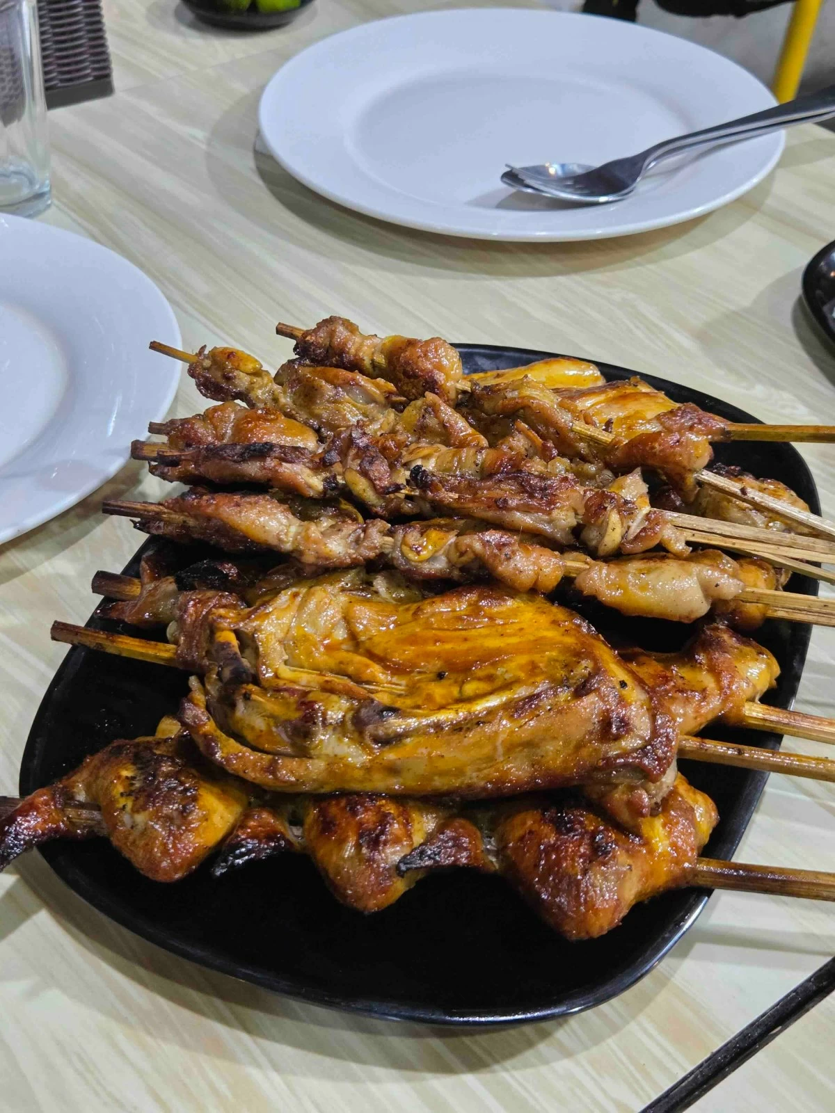 GRILLED GLORY Juicy chicken inasal with garlic rice at Nena’s Beth, a hidden gem near Bredco in Bacolod.