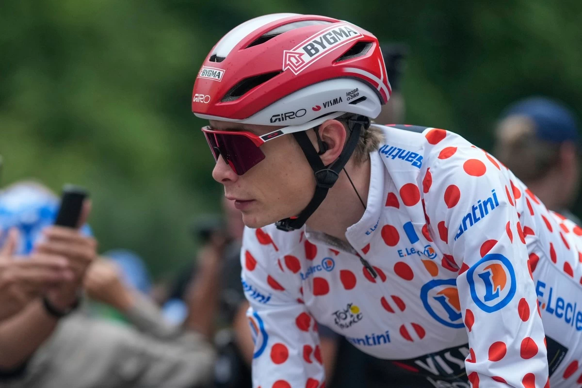 FILE - Denmark's Jonas Vingegaard, wearing the best climber's dotted jersey, arrives for the start of the twenty-first stage of the Tour de France cycling race over 132.3 kilometers (82.1 miles) with start in Mantes-la-Ville and finish on the Champs-Elysees in Paris, France, Sunday, July 27, 2025. (AP Photo/Mosa'ab Elshamy, file)