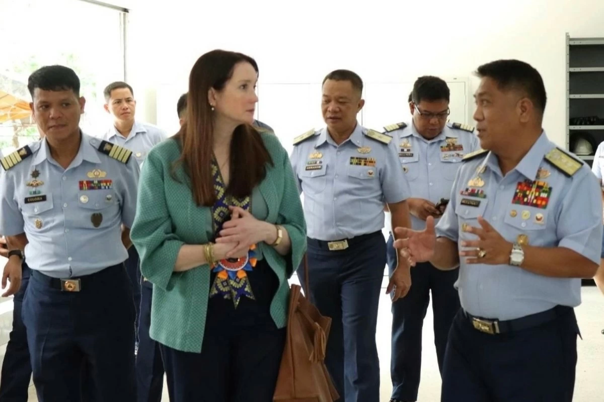 Rear Admiral Supangan and INL Director Riche discuss PCG vessel maintenance during a workshop tour in Cavite.

