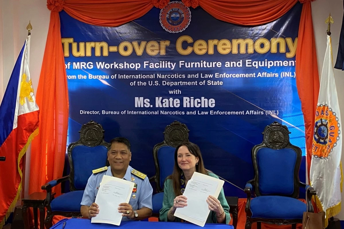 Rear Adm. Rommel Supangan and INL Director Kate Riche sign an agreement for US-donated equipment to the PCG Fleet Maintenance Workshop in Cavite.