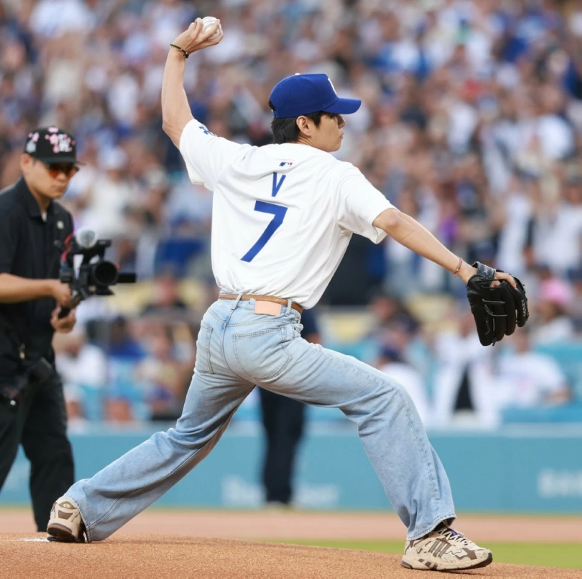 BTS' V throwing the ceremonial first pitch at Dodger Stadium (Photo: MLB on X) 
