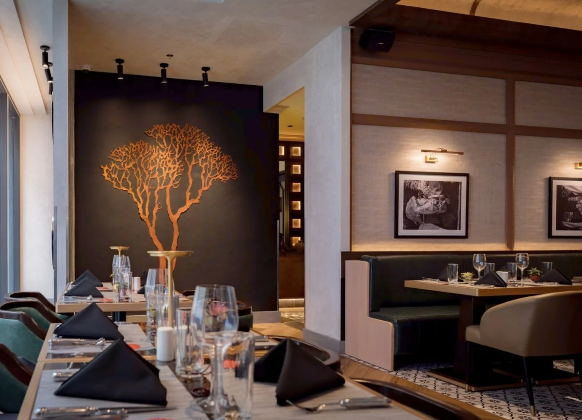HERITAGE MARK Inside the two-level space, the iconic metal tree stands proud, reflecting Fogo de Chão’s story of fire, tradition, and growth.