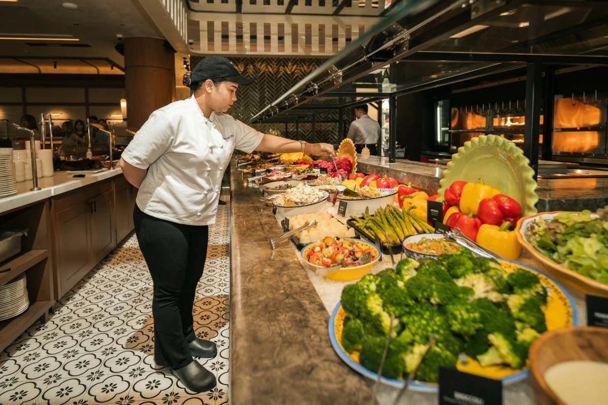 GREEN GLORY The Market Table at Fogo de Chão bursts with fresh greens, charcuterie, cheeses, and feijoada, a colorful counterpoint to the endless parade of meats.