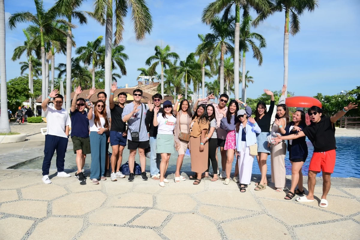 Work-life integration in action: bonding with colleagues and loved ones at annual summer outing.