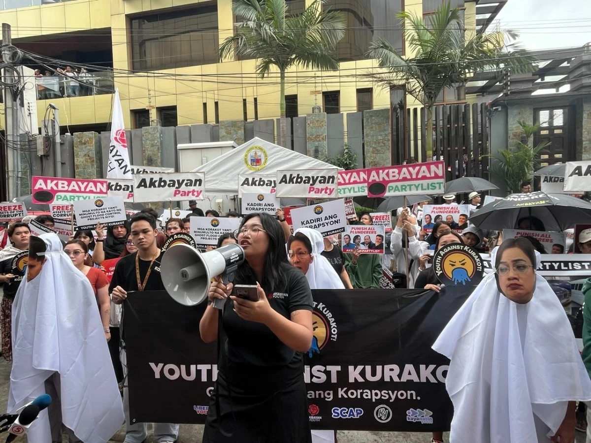 Several groups, including Akbayan and Youth Against Kurakot (YaK!), hold a peaceful creative protest outside the St. Gerrard Construction Building in Pasig City. (Photos from Akbayan Party)